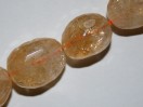 Perle Citrine ovale facettée. La perle