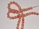 Perle Corail rose ronde. La perle